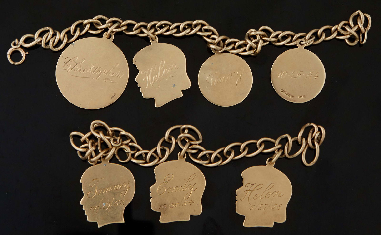 Two 18K Yellow Gold Link Bracelets, one with three 14K profiles of children, L.- 7 3/8 in., Wt.- .68: Two 18K Yellow Gold Link Bracelets, one with three 14K profiles of children, L.- 7 3/8 in., Wt.- .68 Troy Oz; the other with one 14K profile of a girl, two circular 10K charms; and one large 14K circu
