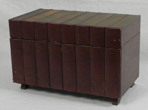 Unusual Portable Bar, 20th c., constructed of leath: Unusual Portable Bar, 20th c., constructed of leather book spines, the "World's Greatest Books," the lifting lid over a fall front, the interior fitted with decanters, glasses and bar tools, H.- 10 3/