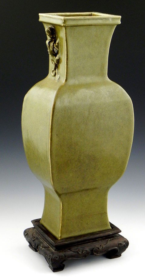 Oriental Green Glaze Earthenware Vase, early 20th: Oriental Green Glaze Earthenware Vase, early 20th c., of square baluster form, with applied salamander handles, mounted on a carved mahogany base, H.- 20 1/4 in., W.- 7 1/2 in., D.- 5 5/8 in.