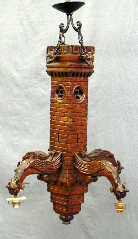 Unusual Carved Beech Medieval Style Four Light Cha: Unusual Carved Beech Medieval Style Four Light Chandelier, 20th c., in the form of a castle, the top with relief gargoyle heads, the lights issuing from bottom gargoyle figures, H.- 28 1/2 in., Dia.- 