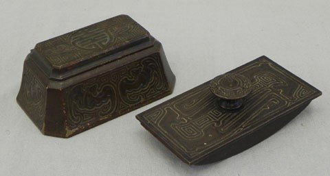 Tiffany Bronze Stamp Box and Rocker Blotter, in th: Tiffany Bronze Stamp Box and Rocker Blotter, in the "Chinese" pattern, both marked "Tiffany Studios, New York," the patinated box marked "1754," Box- H.- 2 3/8 in., W.- 5 1/2 in., D.- 3 9/16 in.