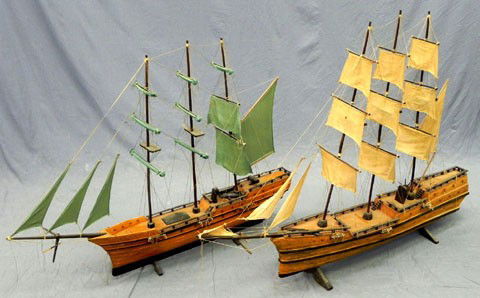 Two Large Carved Mahogany Ship's Models, 20th c.,: Two Large Carved Mahogany Ship's Models, 20th c., of three masted schooners, on carved wooden stands, H.- 31 1/2 in., W.- 42 1/2 in., D.- 4 1/2 in., and H.- 36 1/2 in., W.- 48 in., D.- 6 in.