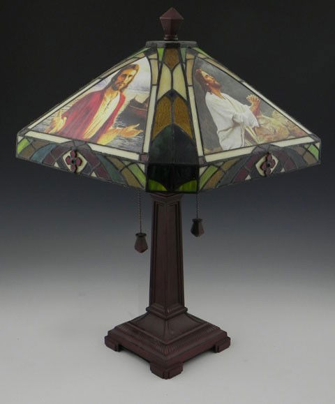 Tiffany Style Leaded Glass Table Lamp, 20th c., ": Tiffany Style Leaded Glass Table Lamp, 20th c., "The Life of Christ," by Del Parson, from the Danbury Mint, the shade resting on a tapering patinated metal support, to a relief sloping square base, H.