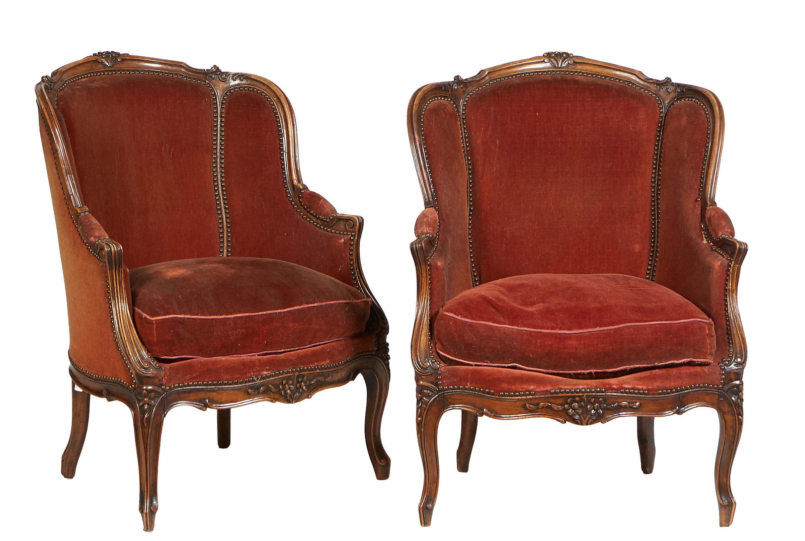 Pair of French Louis XV Style Carved Walnut Bergeres, early 20th c.,the floral carved arched crest (1 of 1)