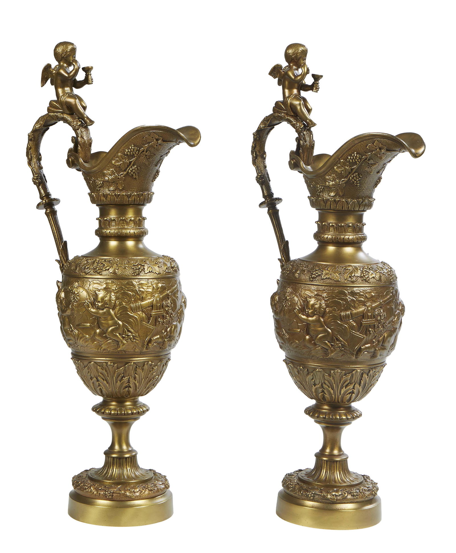 Pair of French Gilt Bronze Baluster Ewers, late 19th c., with a putto handle over a relief band of (1 of 2)