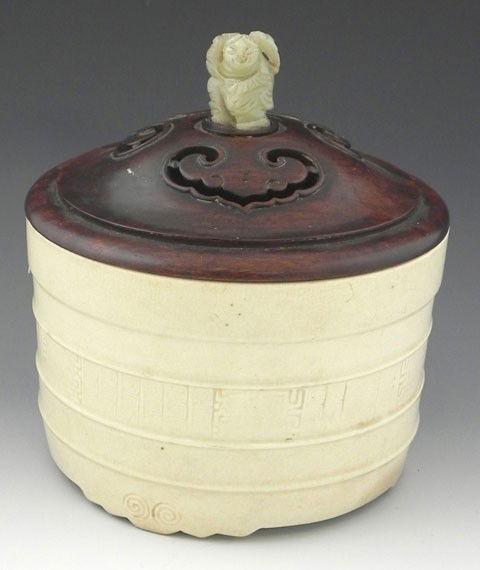 Chinese Glazed Earthenware Barrel, 19th c.,with rib: Chinese Glazed Earthenware Barrel, 19th c.,with ribbed and impressed decoration, signed on the underside, with a pierced rosewood lid with a carved jade figural handle, H.- 7 1/2 in., Dia.- 6 5/8 in.