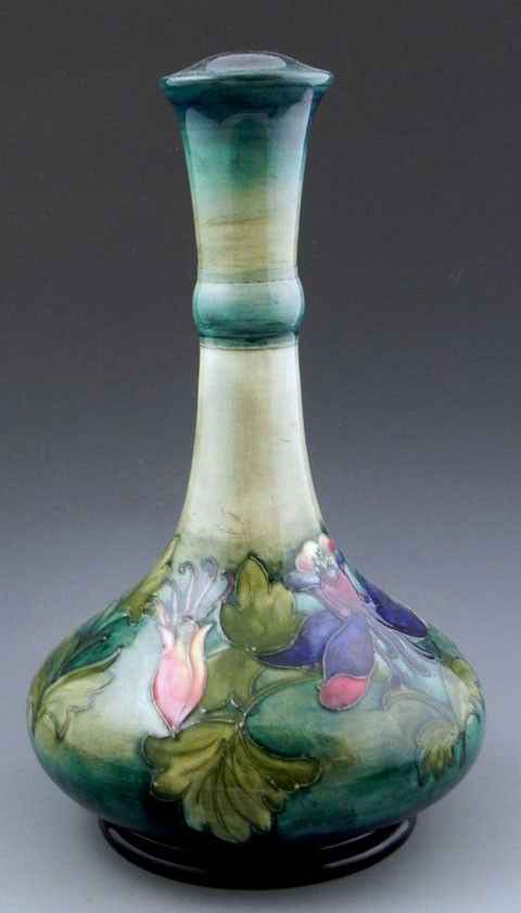 Moorcroft Pottery Columbine Lamp Base, 20th c., im: Moorcroft Pottery Columbine Lamp Base, 20th c., impressed "W. Moorcroft, Potter to H. M. The Queen," also with a paper label "W. Moorcroft Pottery, Potter to H. M. Queen Mary," H.- 13 in., Dia.- 7 3/4