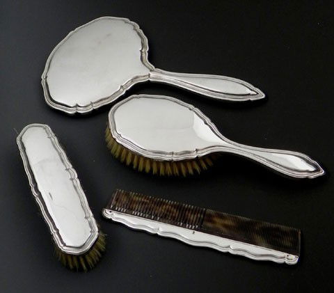 German .800 Silver Four-Piece Dresser Set, early 2: German .800 Silver Four-Piece Dresser Set, early 20th c., by Johann Beck, Schwaebisch-Gmuend, including a hand mirror, a hairbrush, a faux tortoise comb, and a clothes brush, with shaped and molded "C