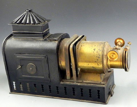 Brass and Iron Magic Lantern Projector, 19th c., b: Brass and Iron Magic Lantern Projector, 19th c., bearing a brass label "Walter Tyler's New Pattern Helioscopic Lantern, London, " H.- 12 3/4 in., W.- 18 3/8 in., D.- 5 1/4 in.