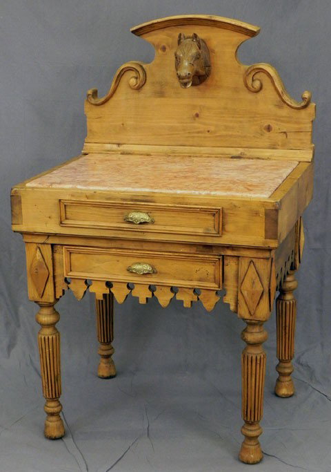 Unusual French Provincial Carved Pine "Chopping Bl: Unusual French Provincial Carved Pine "Chopping Block" Table, 20th c., with a shaped arched crest with a central relief horse's head, above an inset pink marble top on a base with a frieze drawer over