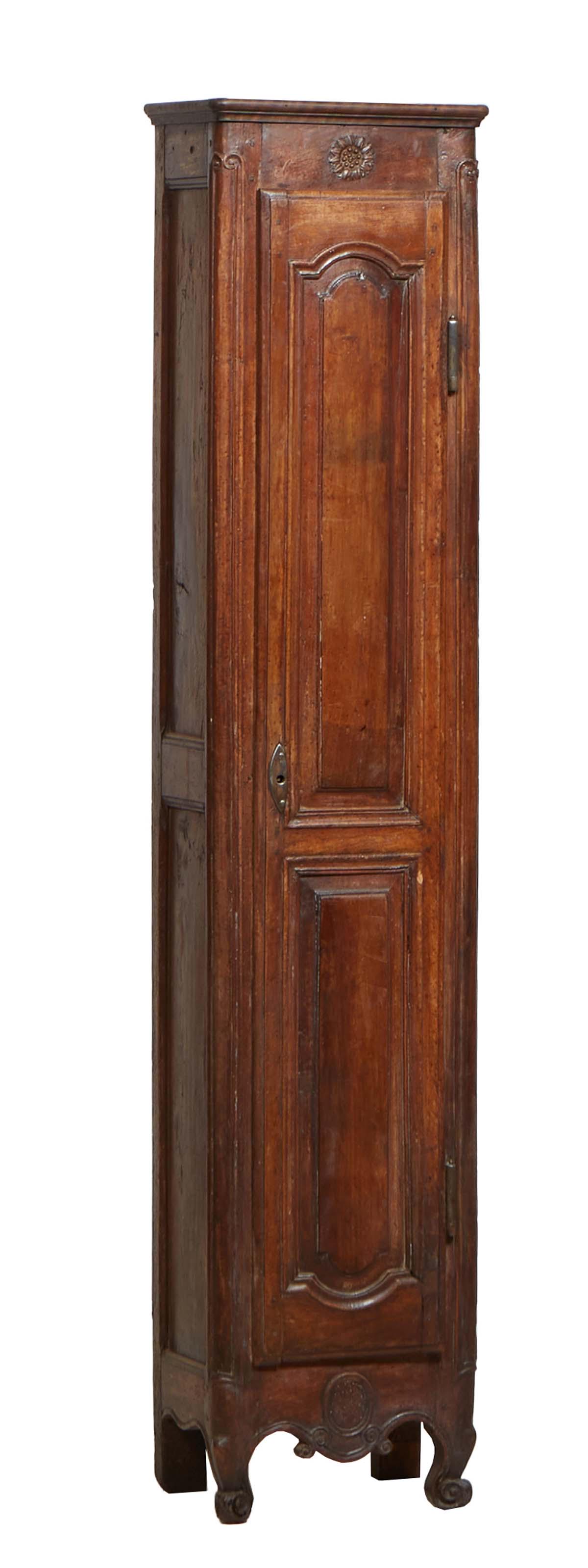 French Louis XV Style Carved Walnut Cabinet, 19th c., the stepped rounded corner top over a long (1 of 1)