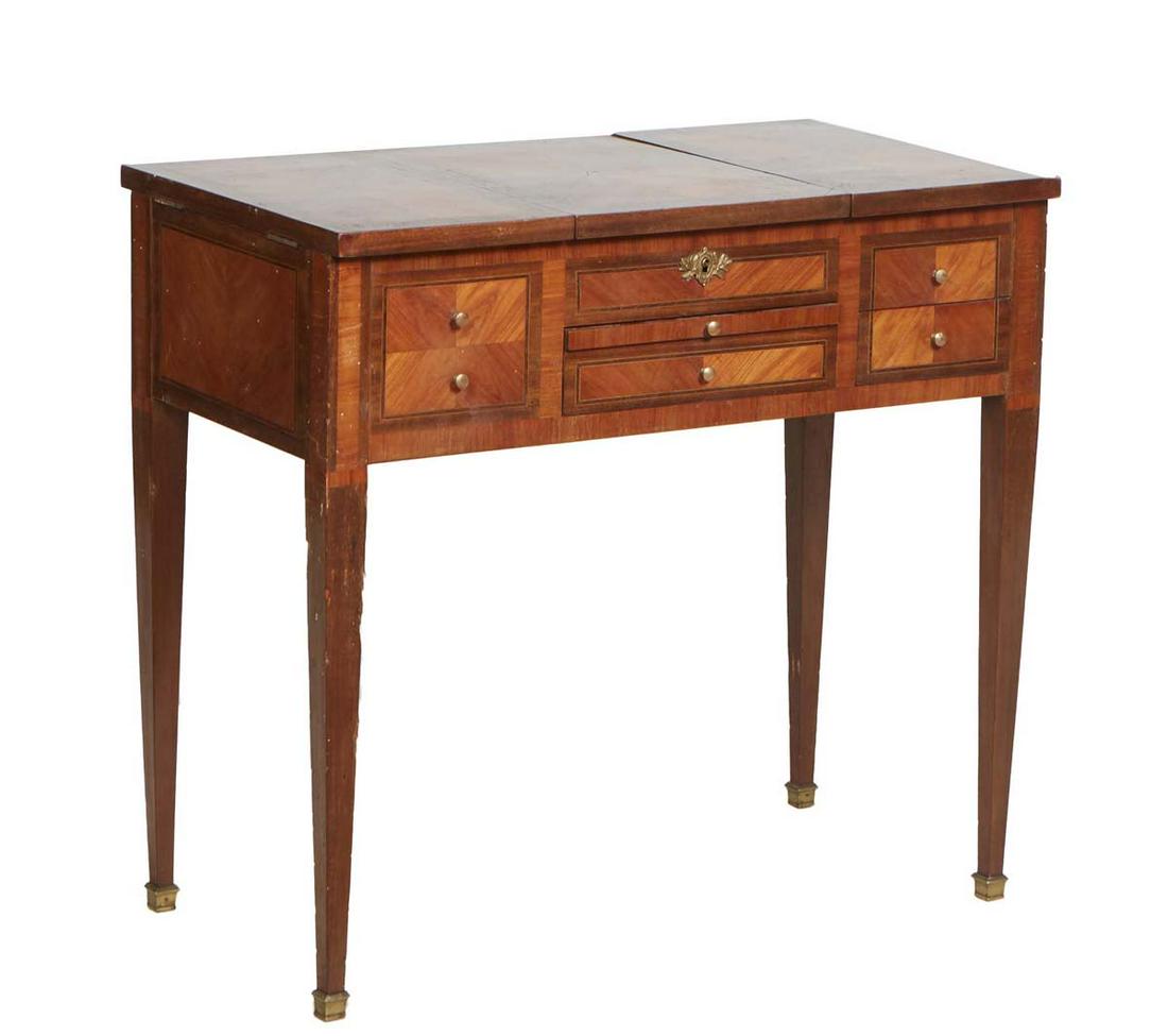 French Louis XVI Style Carved Walnut Dressing Table, early 20th c., the central lifting top with an (1 of 2)