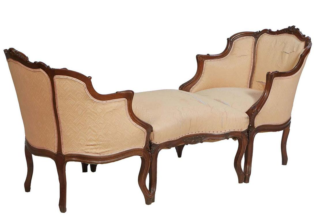French Louis XV Style Carved Walnut Three Piece Duchesse Brisee, 20th c., consisting of a pair of: French Louis XV Style Carved Walnut Three Piece Duchesse Brisee, 20th c., consisting of a pair of bergeres, the arched C-scroll and floral carved crest rail over a curved upholstered back, to upholste