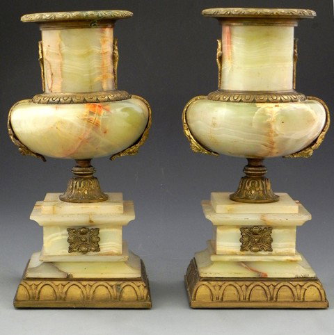 Pair of Onyx and Bronze Continental Mantel Garnitur: Pair of Onyx and Bronze Continental Mantel Garnitures, fourth quarter 19th century, urn-form vases with egg-and-dart bronze rims are mounted on square plinths with bronze feet, the plinth ornamented i