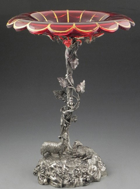 Unusual Elkington Silver Plated Figural Centerpiec: Unusual Elkington Silver Plated Figural Centerpiece, 19th c., the cranberry glass floriform gilt decorated bowl, on a tree form support, to a rocaille base with a relief ram and sheep, H.- 16 1/2 in.,