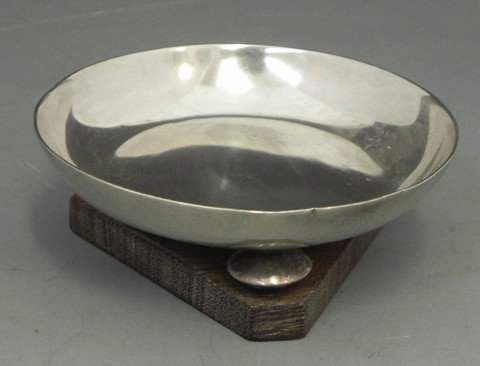 William Spratling (1901-1967), Sterling Footed Sal: William Spratling (1901-1967), Sterling Footed Salt, on a triangular rosewood base, H.- 1 in., Dia.- 2 5/8 in.