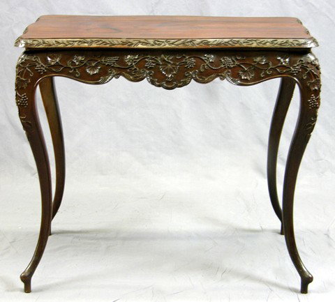 French Carved Rosewood Sofa Table, early 20th c., : French Carved Rosewood Sofa Table, early 20th c., the shaped top with a sloping relief leaf carved edge on a base with shaped skirts with well carved relief leaves and grape bunches, on tall graceful 