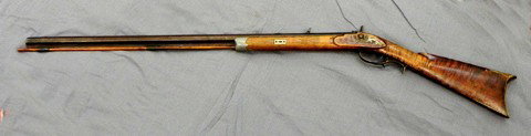 Plains Type Percussion Cap Rifle, c. 1850, .36 or : Plains Type Percussion Cap Rifle, c. 1850, .36 or .38 caliber, the trigger guard with an attached coin silver spur, with a replaced wooden ramrod, H.- 47 in., W.- 1 3/4 in., D.- 4 1/2 in.