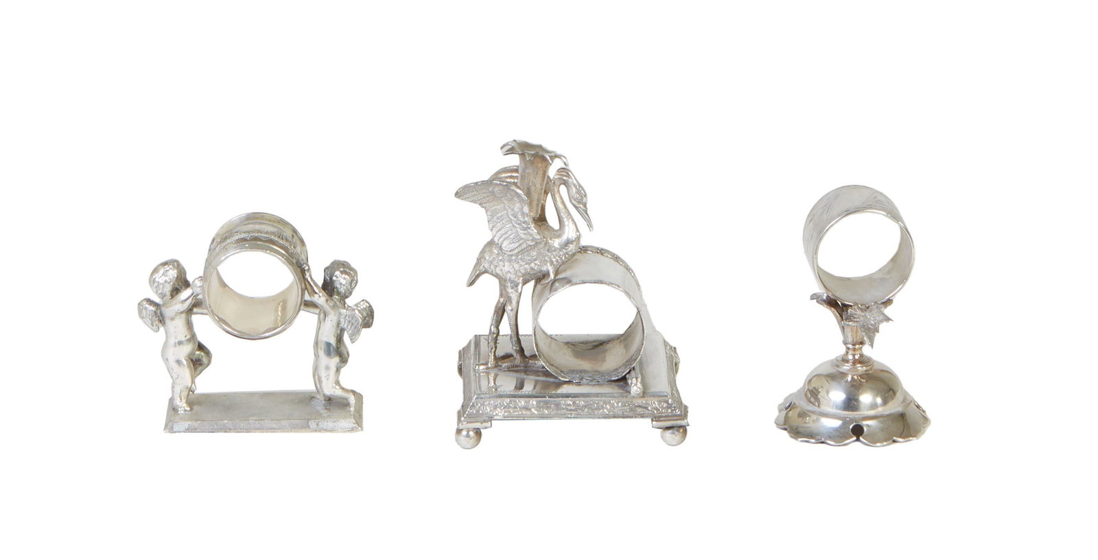 Three Silverplated Napkin Rings, one Meriden with leaf mounts; one figural reproduction Meriden; and (1 of 4)