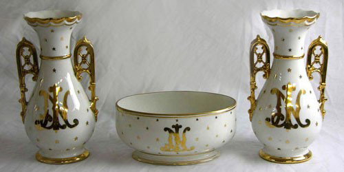 Three Piece French Porcelain Mantel Garniture, c. 1: Three Piece French Porcelain Mantel Garniture, c. 1900, consisting of an oval center bowl and a pair of handled vases, all with gilt decoration, monogrammed "JN," Vases- H.- 11 3/4 in., W.- 6 1/4 in.,