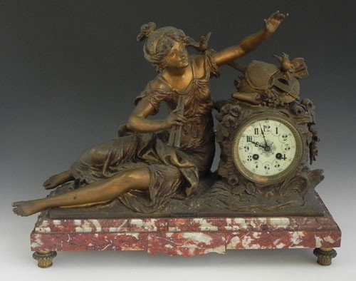 After Louis and Francois Moreau, Gilt Patinated Sp: After Louis and Francois Moreau, Gilt Patinated Spelter and Rouge Marble Mantel Clock, c. 1900, by. J Marti & Cie, time and strike, depicting the muse of music, the drum clock with a surmount of a lut
