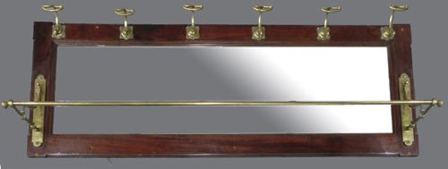 Carved Mahogany and Brass Wall Hat Rack, c. 1910,: Carved Mahogany and Brass Wall Hat Rack, c. 1910, with six brass hooks over a rectangular mirror, the bottom with an extending umbrella rail, H.- 23 in., W.- 58 3/4 in., D.- 12 1/4 in.