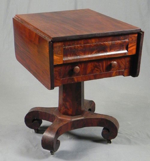 American Classical Carved Mahogany Drop Leaf Work: American Classical Carved Mahogany Drop Leaf Work Table, 19th c., the side with two drawers, on a tapered octagonal support, to a quadruped base on scrolled feet, H.- 29 3/4 in., W.- Closed- 21 1/4 in
