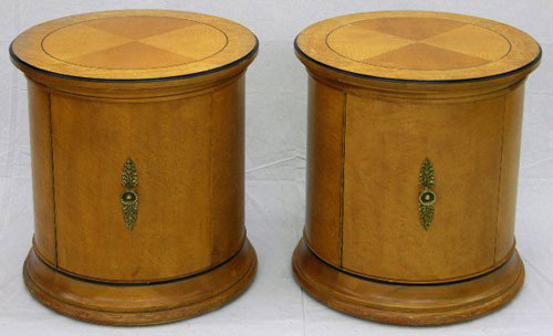 Pair of Circular Carved Mahogany Biedermeier Styl: Pair of Circular Carved Mahogany Biedermeier Style End Tables-Cabinets, 20th c., with ebonized accents, each with a single door, H.- 24 1/2 in., Dia.- 22 in.