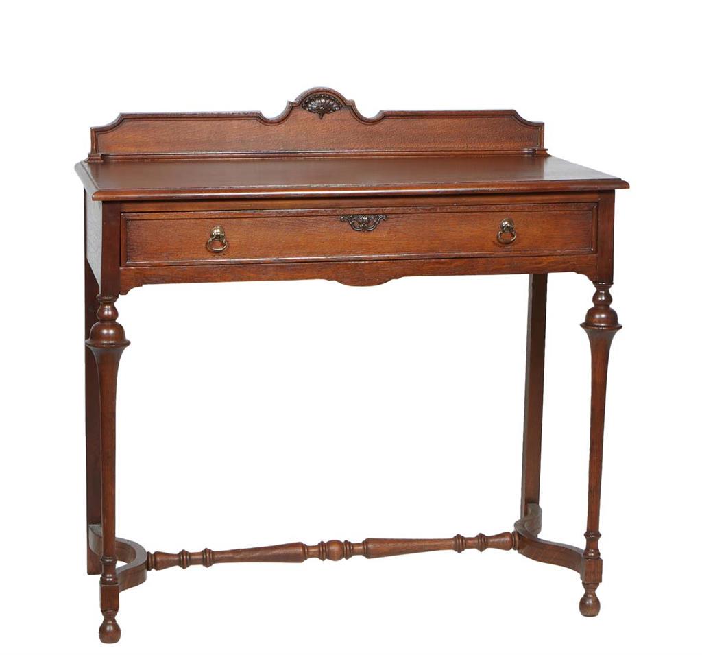 Diminutive English Carved Oak Sideboard, 20th c., with an arched splash back, on a rounded edge top (1 of 1)