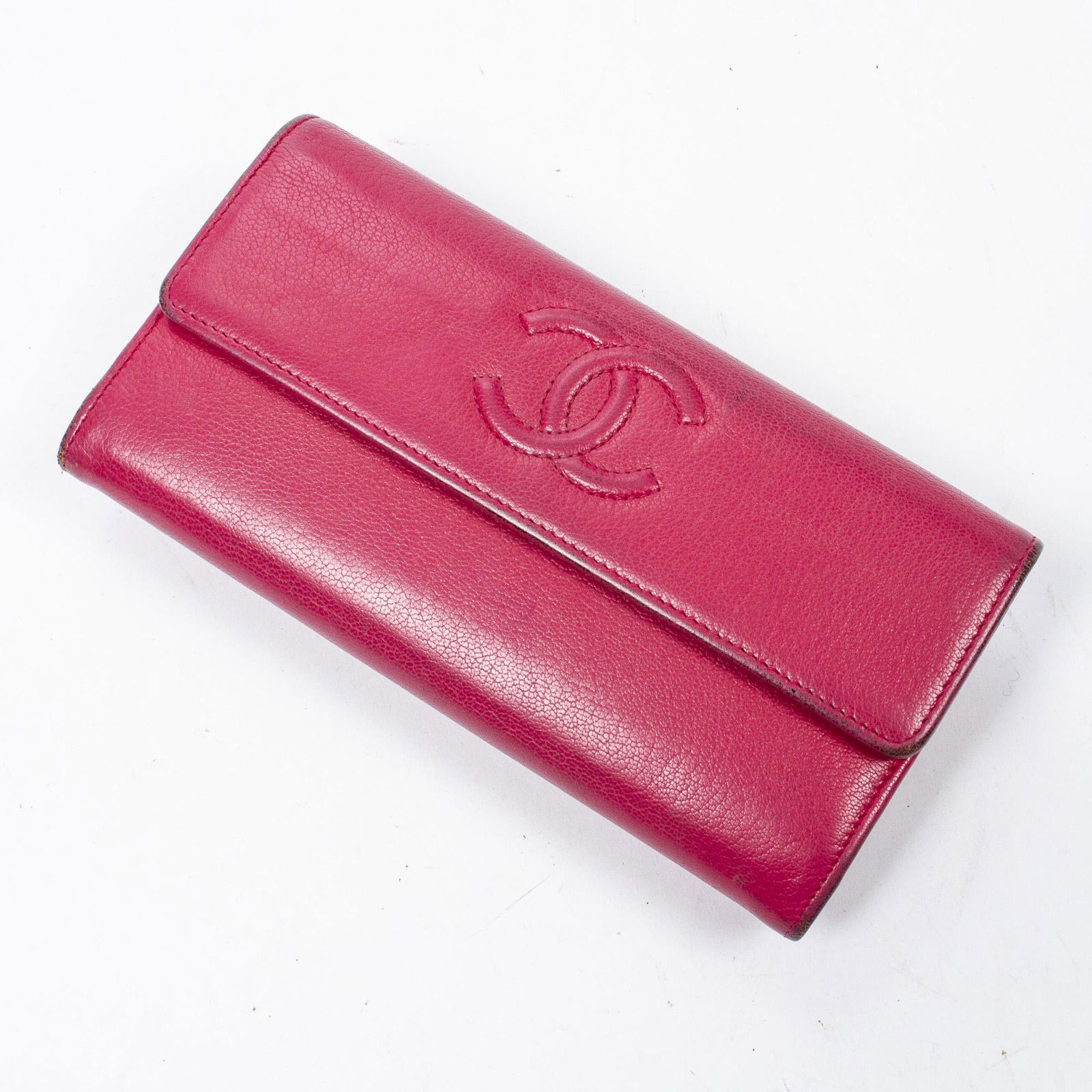 Chanel Half Flap CC Wallet, in fuchsia deerskin leather, front flap with snap closure, opening to a (1 of 4)