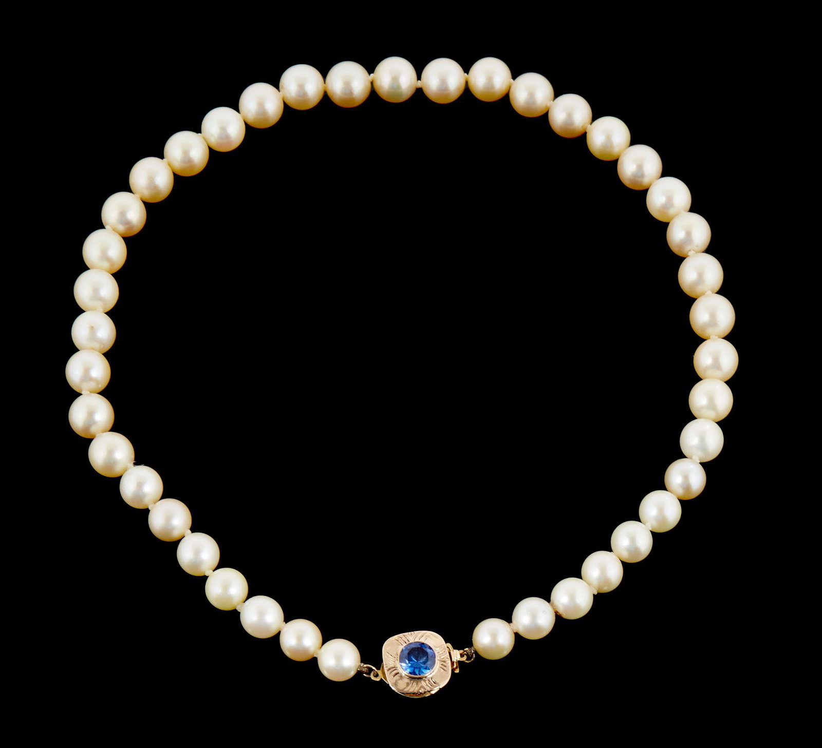 Lady's Graduated Pearl Choker, with 41 10mm white cultured pearls, ranging from 9.3-10.5 mm., and a: Lady's Graduated Pearl Choker, with 41 10mm white cultured pearls, ranging from 9.3-10.5 mm., and a 14K yellow gold clasp mounted with a circular blue stone, L- 15 1/2 in. Proper forms of payment acce