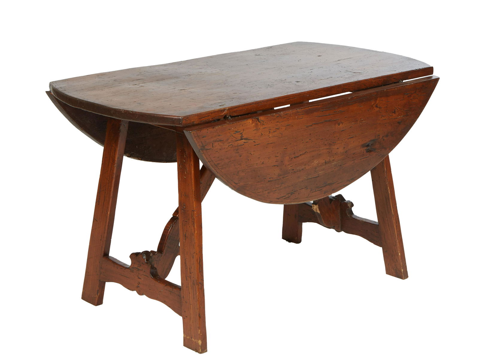 Continental Carved Walnut Drop Leaf Dining Table, late 19th c., the circular top on trestle (1 of 2)