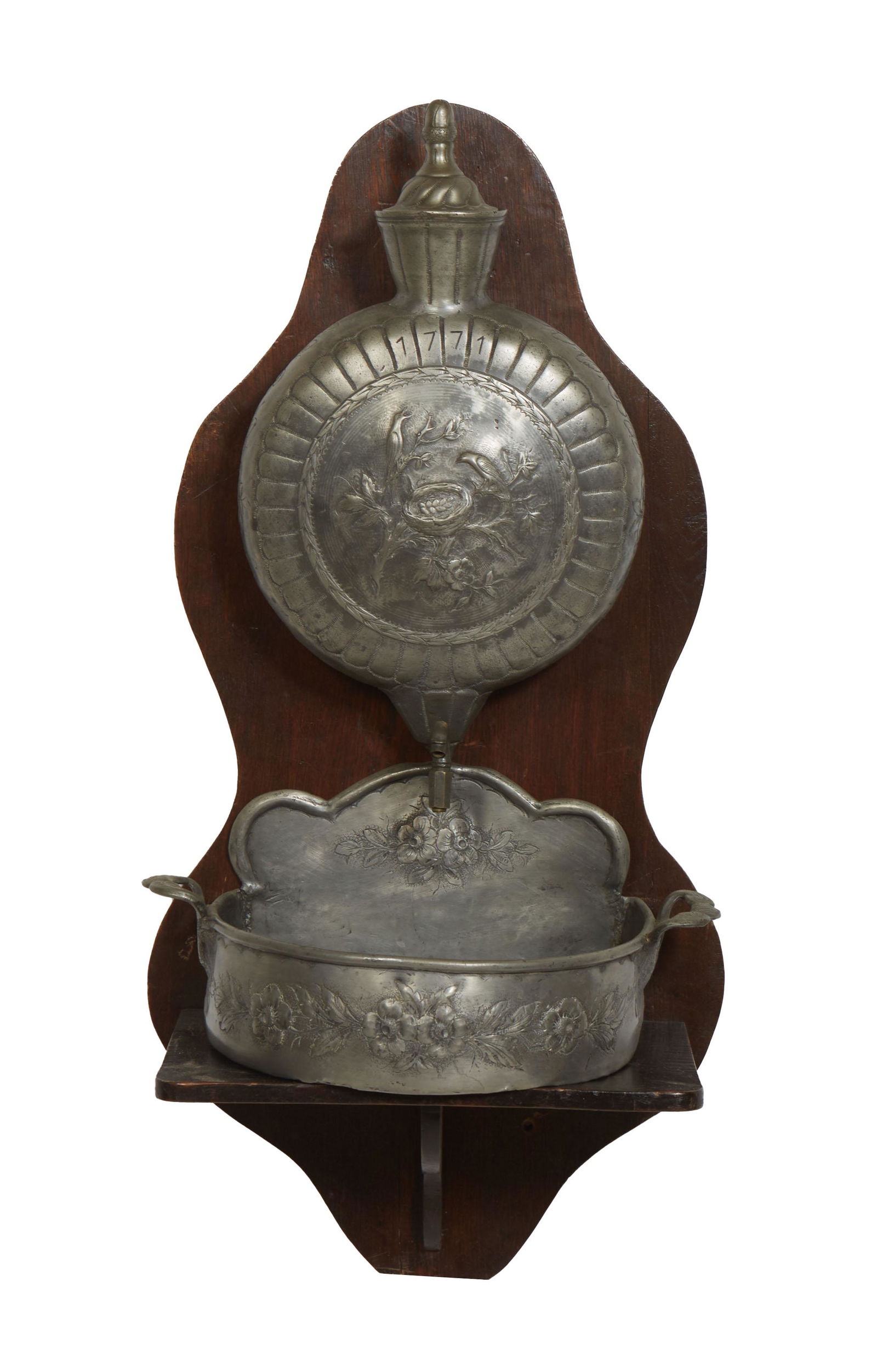 French Provincial Pewter Lavabo, 19th c., with a repousse bird decorated reservoir, over a like (1 of 1)