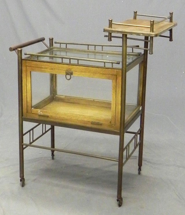 Brass Rolling Dessert Cart, 20th c., with a glass: Brass Rolling Dessert Cart, 20th c., with a glass top and sides, with a galleried top, H.- 40 1/4 in., W.- 33 1/2 in., D.- 17 1/2 in