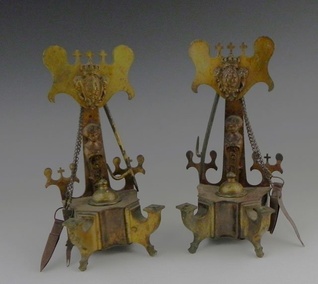 Pair of Brass Midddle Eastern Oil Lamps, 20th c., : Pair of Brass Midddle Eastern Oil Lamps, 20th c., the backs with cross surmounts and applied relief shields with crowns, with attached wick implements, H.- 9 1/2 in., W.- 5 in., D.- 4 in.