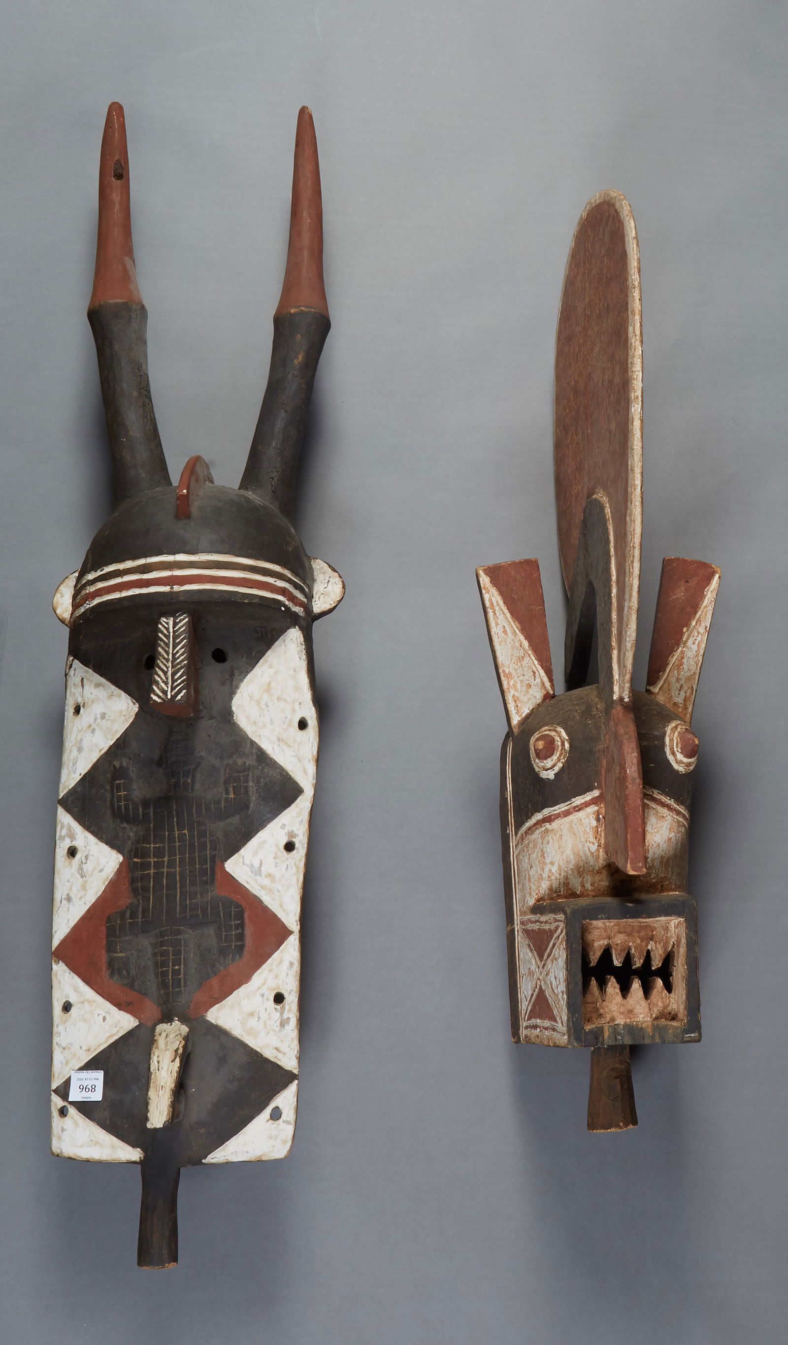Two Large Polychromed Wood African Masks, 20th c., one of a horned figure, H.- 47 1/2 in., W.- 12 (1 of 1)