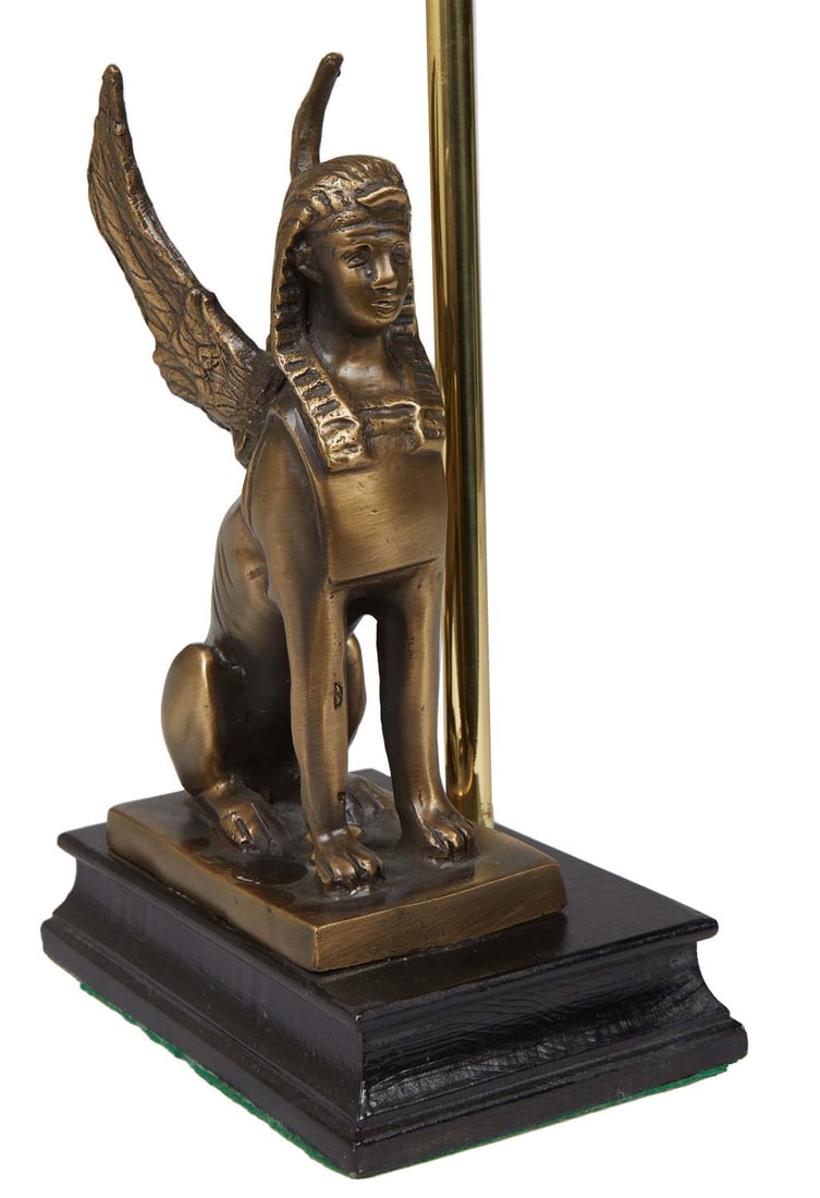 Egyptian Revival Style Patinated Metal Table Lamp, 20th c., with a winged sphinx on a stepped reeded (1 of 2)