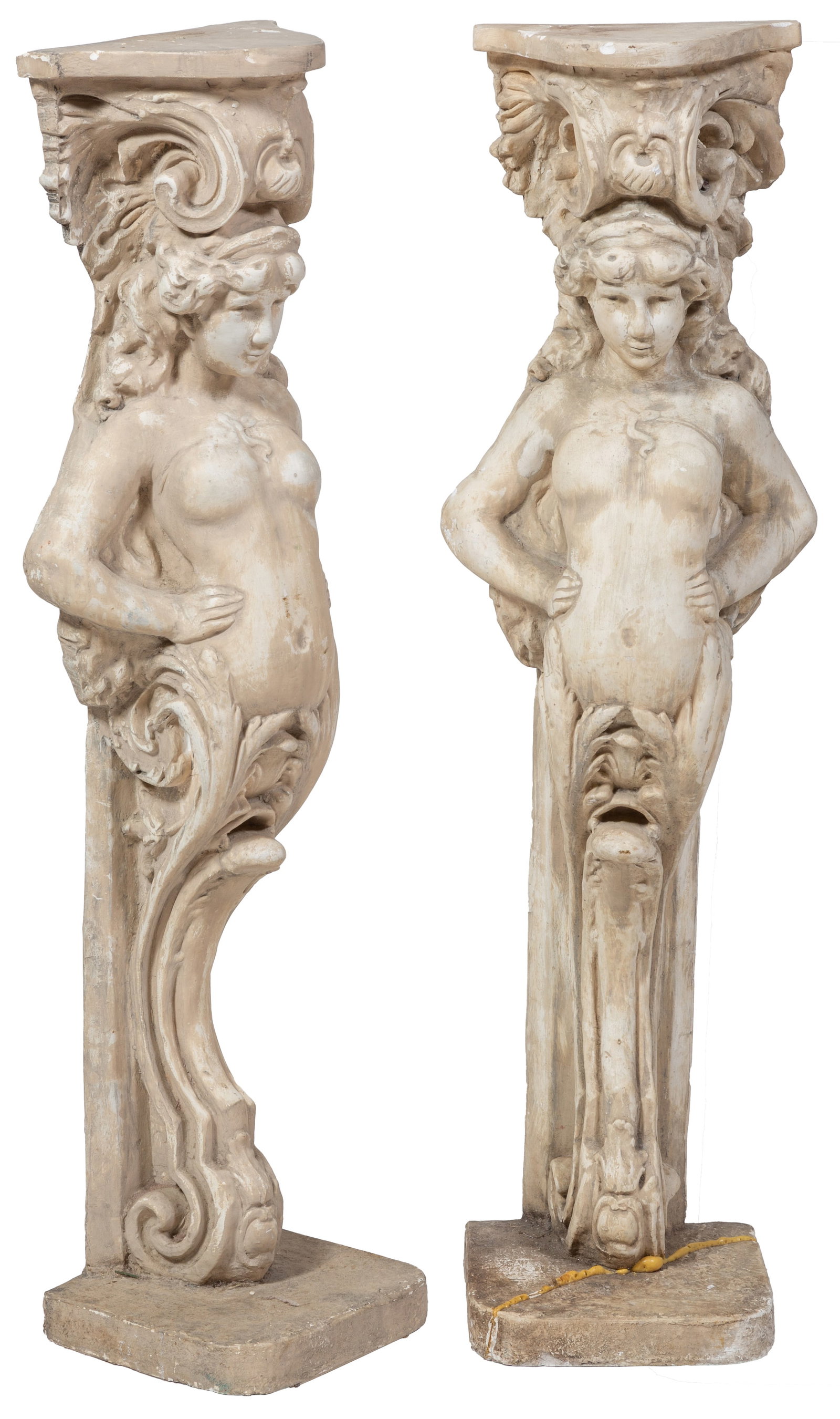 Pair of Figural Plaster Columnar Pedestals, 20th c., H.- 43 1/2 in., W.- 10 in., D.- 9 3/8 in.: Pair of Figural Plaster Columnar Pedestals, 20th c., of half-nude female figures on scrolled supports to a rounded square plinth base, H.- 43 1/2 in., W.- 10 in., D.- 9 3/8 in.