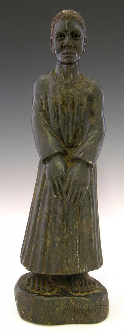 Carved Marble Figure of a Black Woman, early 20th c: Carved Marble Figure of a Black Woman, early 20th c., in a long dress or choir robe, with bare feet, on an integral marble base, H.- 13 3/4 in., W.- 4 1/4 in., D.- 3 3/4 in.
