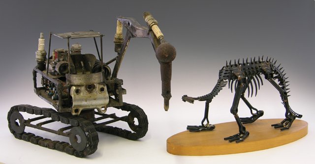 Two Pieces of Tramp Art, 20th c, one of a Caterpil: Two Pieces of Tramp Art, 20th c, one of a Caterpillar hydraulic jackhammer, the other of a dinosaur skeleton. (2 Pcs.)