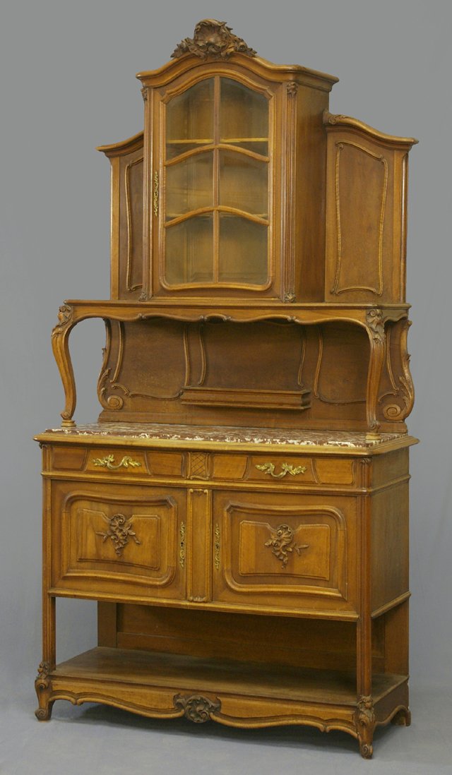 French Carved Mahogany Louis XV Style Marble Top S: French Carved Mahogany Louis XV Style Marble Top Sideboard, early 20th c., with an arched shell and floral crest over a central arched door with six beveled mullioned glass panes, flanked on both side