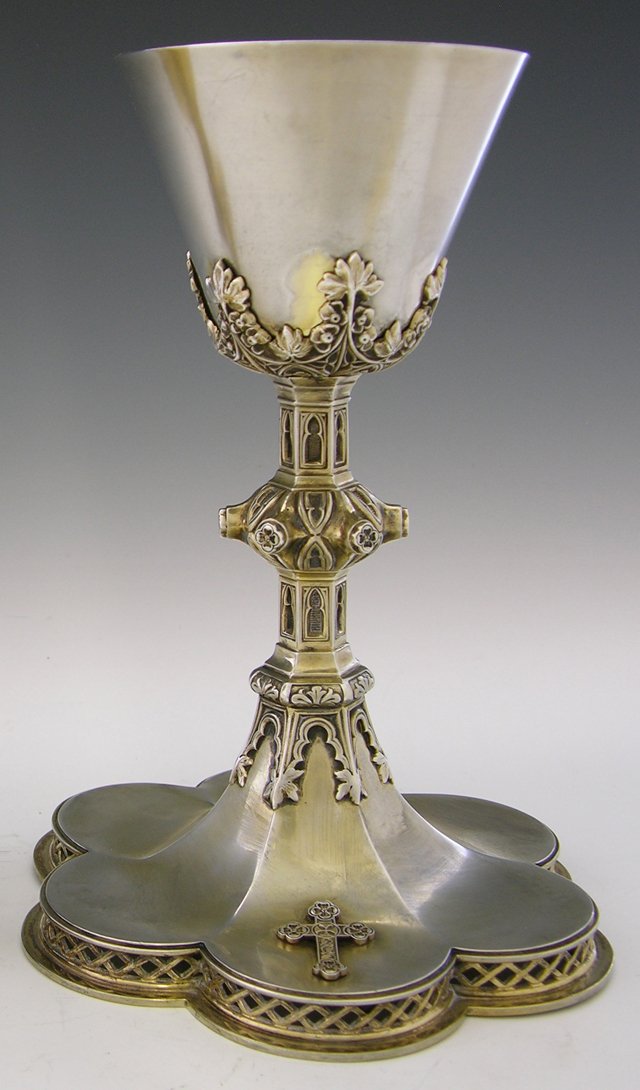 Sterling Communion Chalice, 20th c., with a relief: Sterling Communion Chalice, 20th c., with a relief Gothic support, on a pierced and lobed base with an applied relief cross, the underside engraved "Howell, Kent, Lucille, Godfrey, Joseph L. Champagne