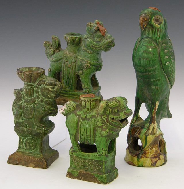 Group of Four Chinese Glazed Earthenware Figures,: Group of Four Chinese Glazed Earthenware Figures, late 19th c., consisting of three Foo dogs and a parrot, two pieces with export wax seals. (4 Pcs.)