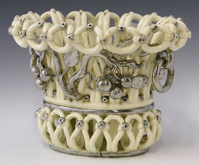 Two Unusual "Woven" Glazed Earthenware Baskets, 2: Two Unusual "Woven" Glazed Earthenware Baskets, 20th c., one oval and one circular with a liner, with silvered fruit and grape decoration. (2 Pcs.)