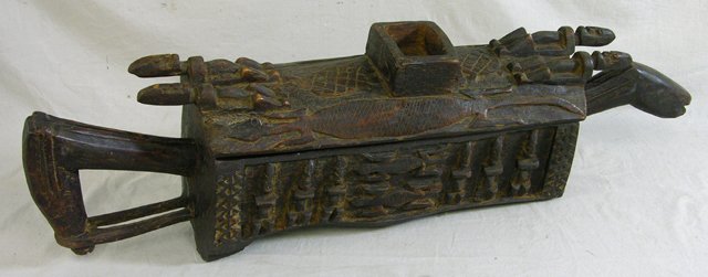 Unusual African Carved Wooden "Horse" Box, early : Unusual African Carved Wooden "Horse" Box, early 20th c., the top and sides with relief figural decoration, crocodiles, lizards and turtles, with a lifting lid, H.- 10 1/2 in., W.- 40 in., D.- 7 1/2 i
