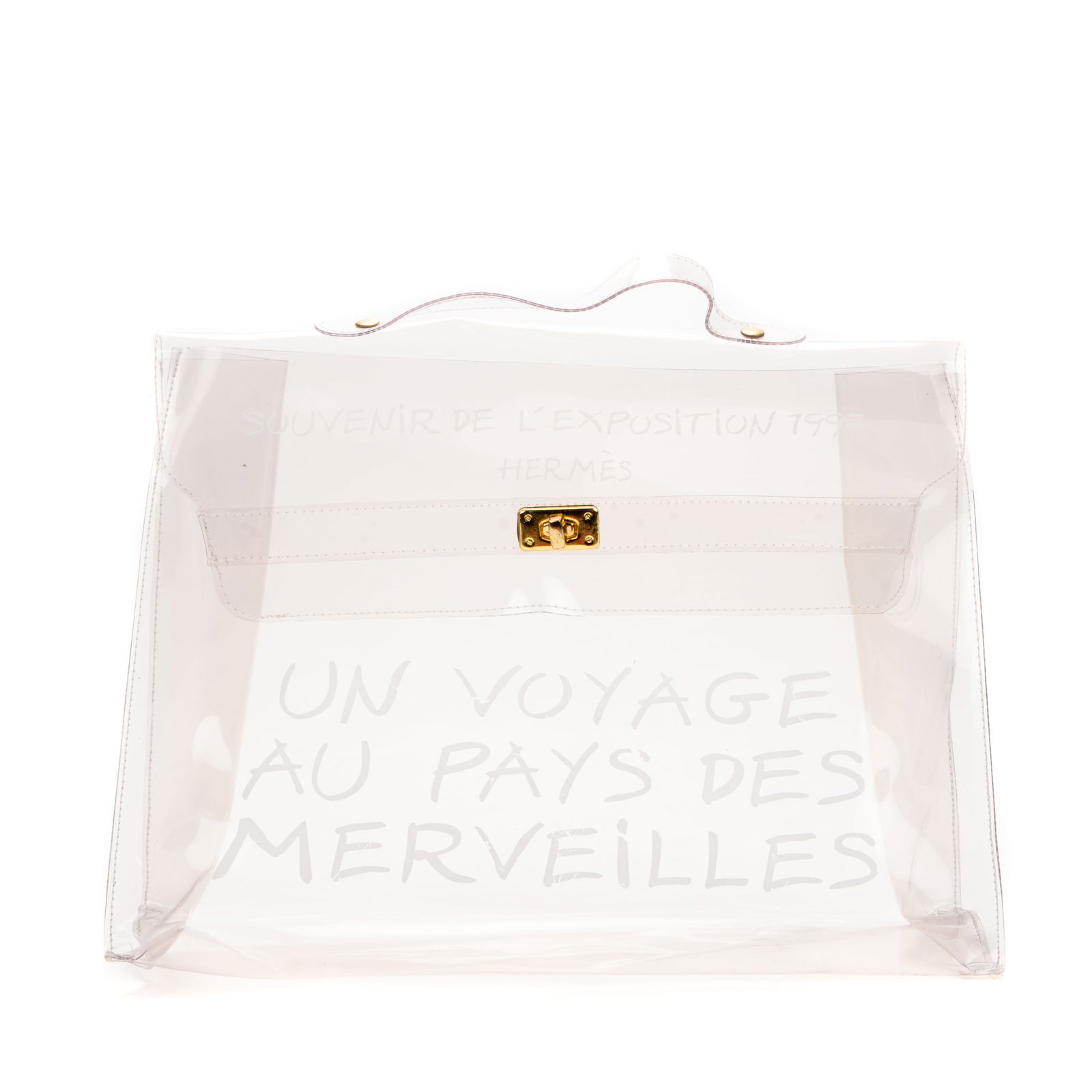Hermes Limited Edition, Souvenir de L'Exposition Kelly Handbag, 1997, H.- 12 in., W.- 15 1/2 in.: Hermes Limited Edition, Souvenir de L'Exposition Kelly Handbag, 1997, in transparent vinyl, with brass hardware and white script "Souvenir de L'Exposition 1997/ Hermes/ Un Voyage au Pays des Merveille