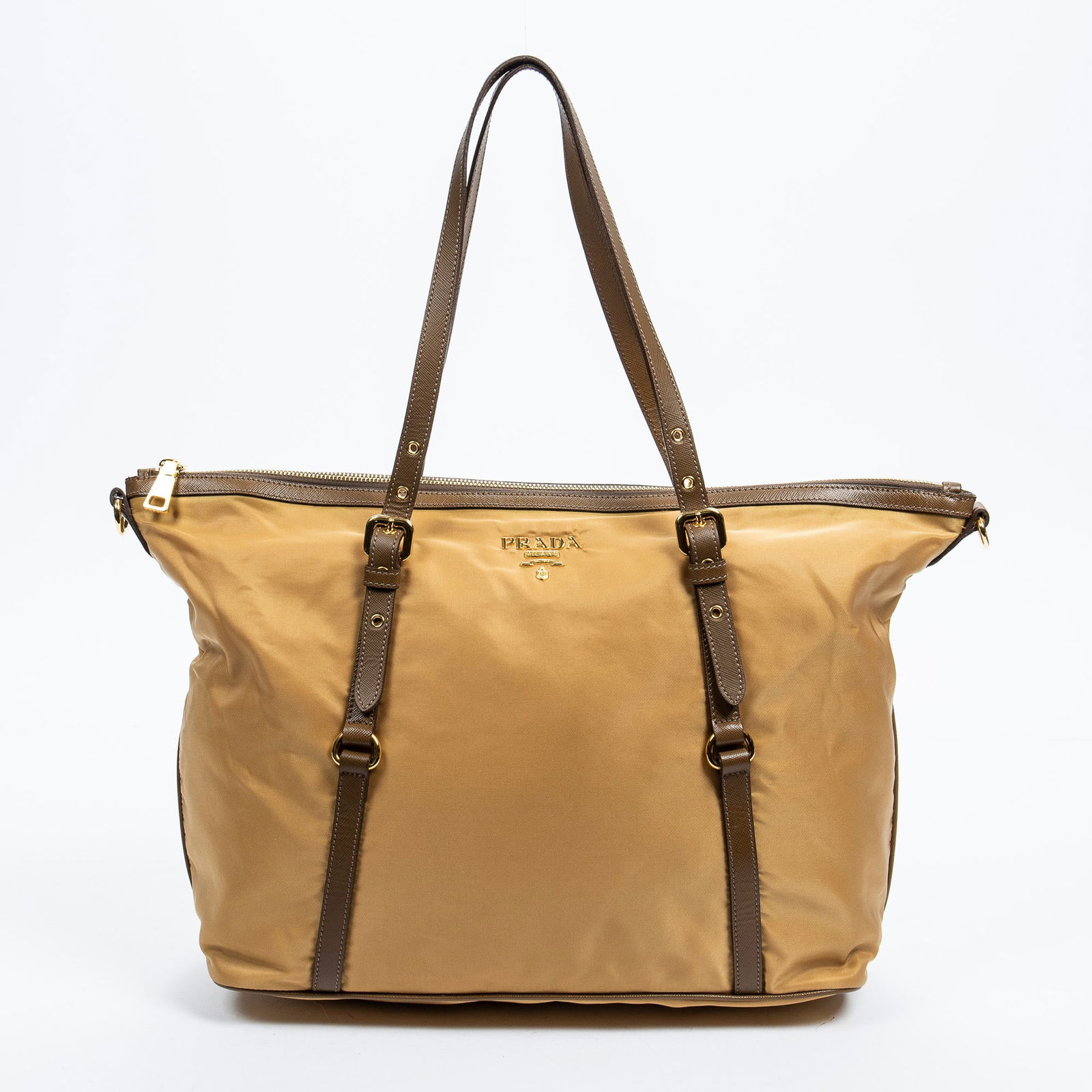 Prada Shopper Zip Tote Bag, H.- 12 in., W.- 18 in.: Prada Shopper Zip Tote Bag, in beige nylon, with brown leather and golden brass hardware, adjustable shoulder strap, top zip closure, opening to a monogram canvas lining with a zip pocket and a slip p