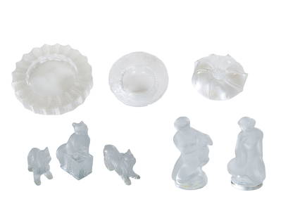 Collection of Eight Lalique Crystal Figurines and Dishes, 20th c., Largest Figure- H.- 4 1/2 in.,: Collection of Eight Lalique Crystal Figurines and Dishes, 20th c., consisting of two Yorkshire Terrier dogs, a cat on a box, Leda and the Swan, a female nude with a baby goat, a nautilus, a