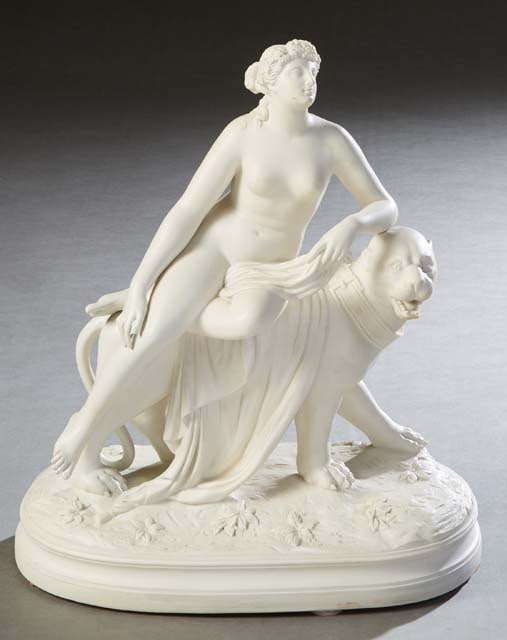 Parian Figure of a Nude Classical Woman, 19th c., H.- 15 1/2 in., W.- 13 1/2 in., D.- 7 1/4 in.: Parian Figure of a Nude Classical Woman, 19th c., reclining atop a lion, on a stepped integral oval base, H.- 15 1/2 in., W.- 13 1/2 in., D.- 7 1/4 in. Provenance: The Collection of Ronald Ralpheal Le