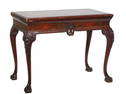 Chippendale Style Carved Mahogany Dining Table, 20th c., with an inset gilt tooled red leather top,